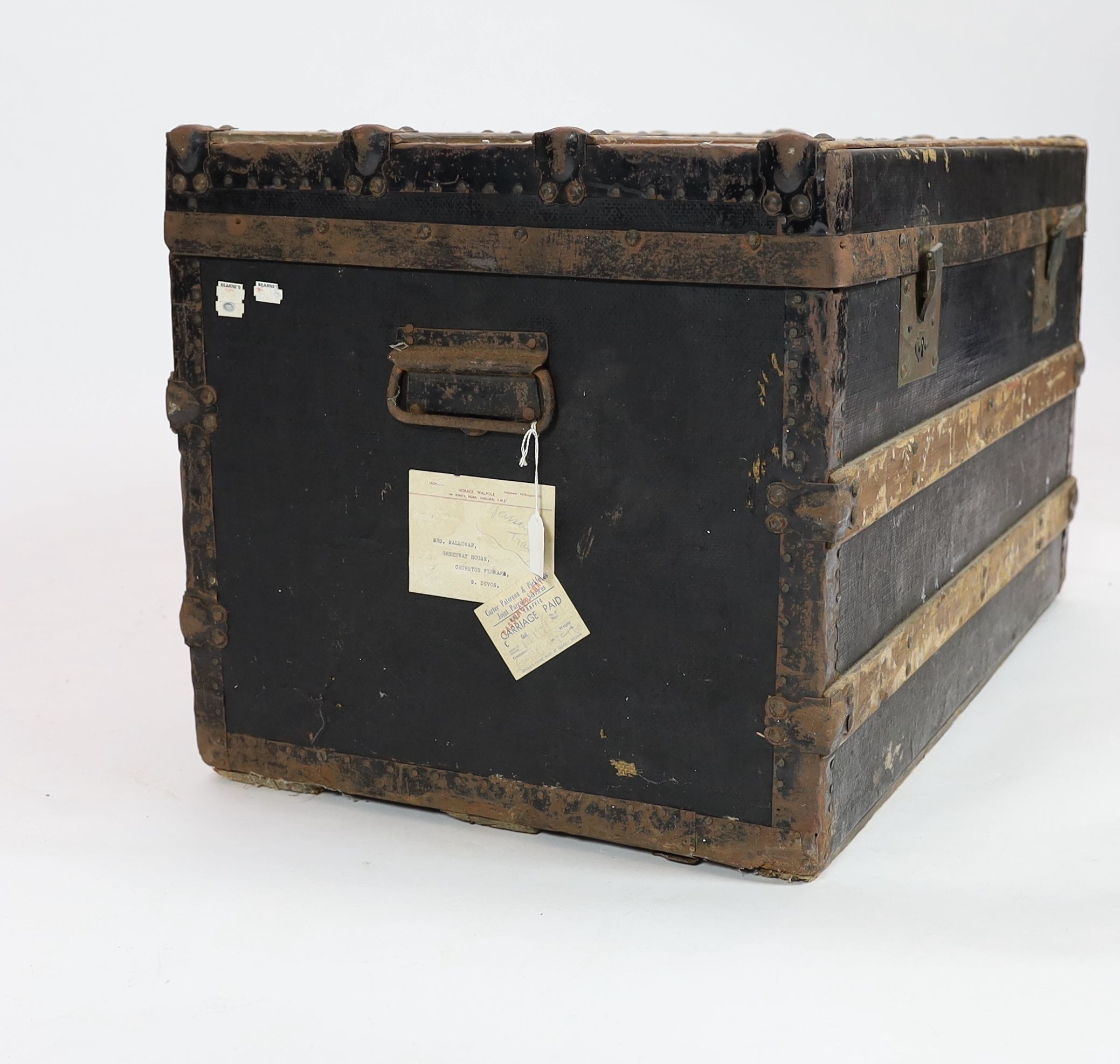 A metal mounted canvas and wood bound cabin trunk, bearing labels relating to 'Mrs Mallowan', 84cm wide